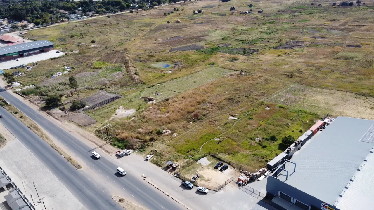 Wider aerial context of the surrounding commercial setting.